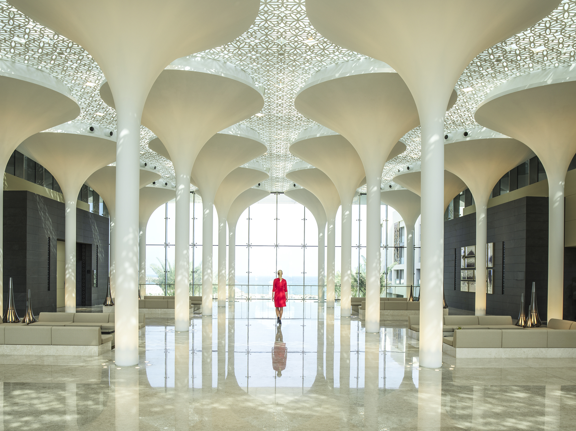 Kempinski Hotel Muscat – Lobby Interior with Lady in Red